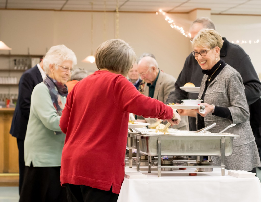 2019 Fall Dinner Membership Meeting - people dishing out food